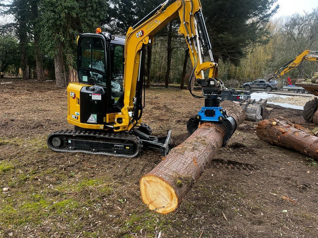 Cat 302.7 excavator with attachments